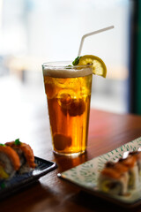 Lychee Iced Tea or Es Leci tea with Mint Leaves in a Glass