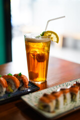 Lychee Iced Tea or Es Leci tea with Mint Leaves in a Glass