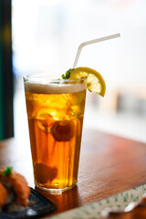 Lychee Iced Tea or Es Leci tea with Mint Leaves in a Glass