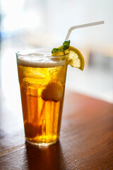 Lychee Iced Tea or Es Leci tea with Mint Leaves in a Glass