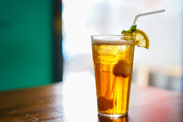 Lychee Iced Tea or Es Leci tea with Mint Leaves in a Glass