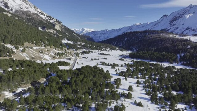 Pass road on the Lukmanier Pass in late winter with a view of a protective structure, road protection against debris flow, drone image, Vallone di Casaccia, Ticino, Switzerland, Europe