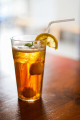 Lychee Iced Tea or Es Leci tea with Mint Leaves in a Glass