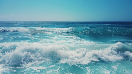 Obraz premium the concept of World Ocean Day. Beautiful nature landscape. World Water Day. A vast ocean with waves, turquoise water, and a clear sky in the distance. 