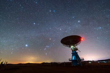 radio telescope on the background of stellar tracks, The observatory's radio telescope