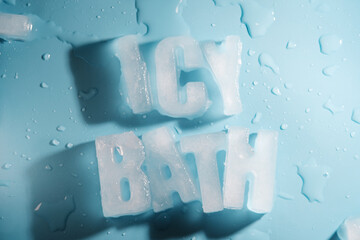Word Icy Bath using frozen alphabet on blue background