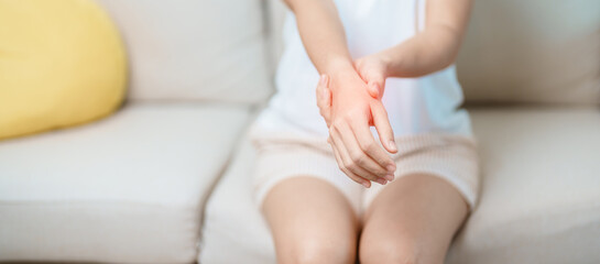 Woman having wrist pain at home, muscle ache due to De Quervain s tenosynovitis, ergonomic, Carpal...