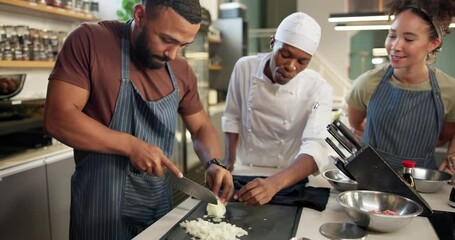 Cooking class, chef and people with mentor for teaching skill in kitchen for culinary talent. Professional group, learning and training as interns in restaurant with knife practice and education