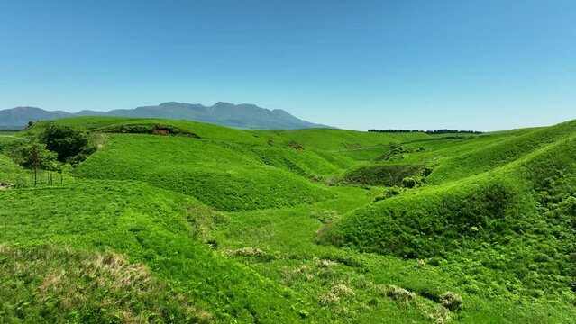 Drone aerial shots of spectacular greenery landscapes and blue sky. Dynamic natural scenery.