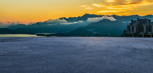 Asphalt road square and beautiful mountain natural landscape at dusk. panoramic view.
