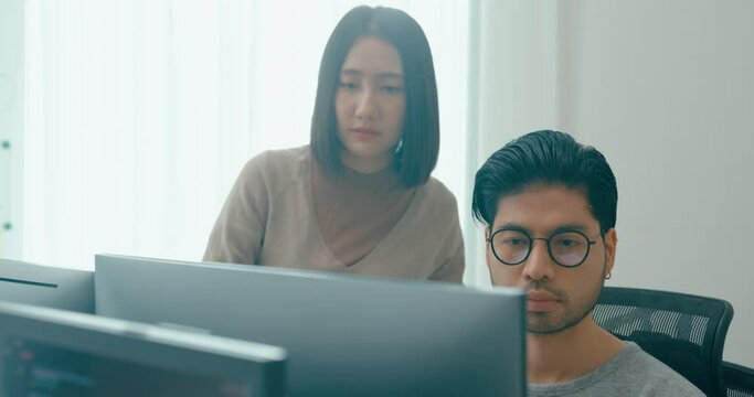 Group Adult Asia male, female freelance meeting write prompt AI bot IT app smart program nomad, video game, talk strategy, discuss plan, user interface, designer, big data center on desktop computer.