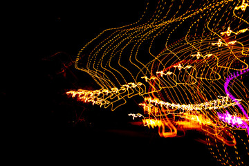 Abstract background with waves of lights on black