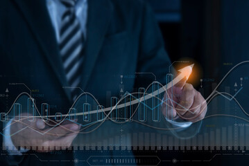 Close up of businessman hand pointing at abstract upward digital chart arrow. Trade stock and...
