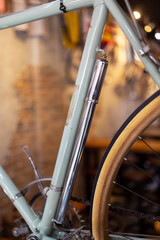 Bicycle pump is located along frame