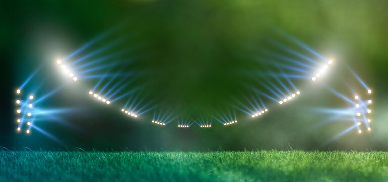 Empty night football arena in lights