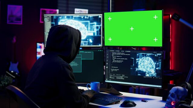 Hacker using green screen PC and AI to find unpatched connections and steal data. Scammer using artificial intelligence and chroma key computer to compromise digital devices, camera B