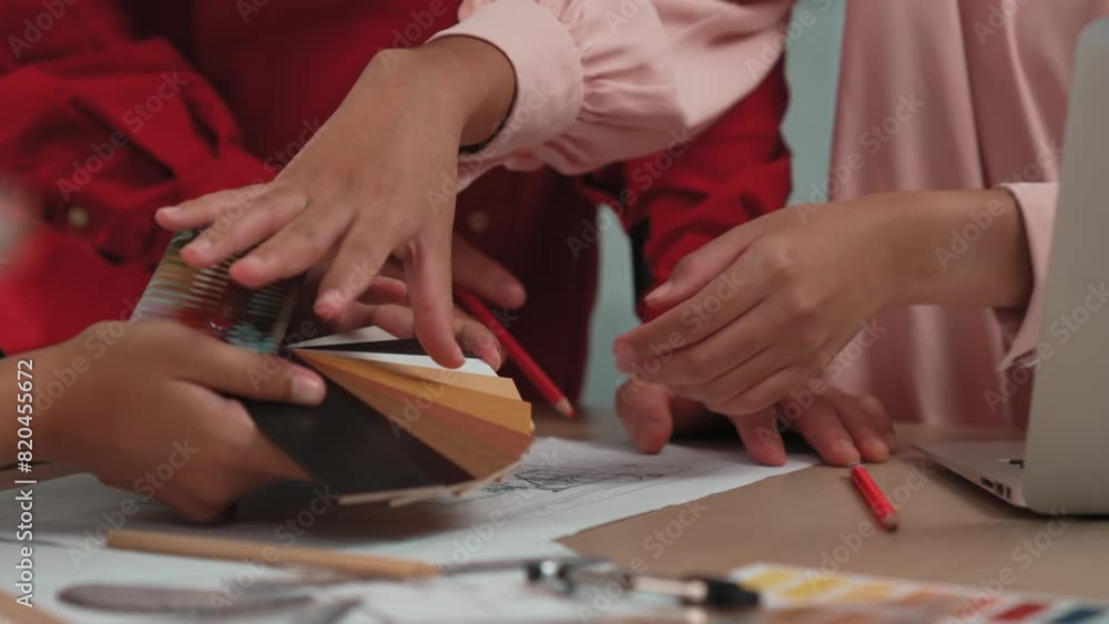 Poster slow motion hand closeup of professional architect and interior designer presenting material and col