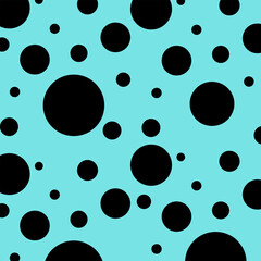 Black dots  circles on a mint green background.
