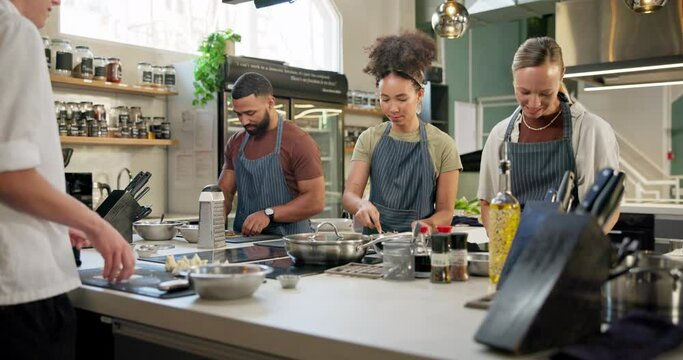 Cooking class, restaurant and people with culinary instructor in kitchen for learning, education course or practice. Gastronomy, chef and diverse students for meal, preparation or working on skills
