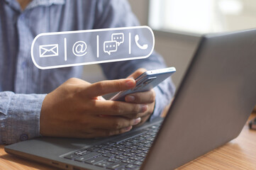 using a smartphone contact customer hotline service, contact us symbols with e-mail, address, chat...