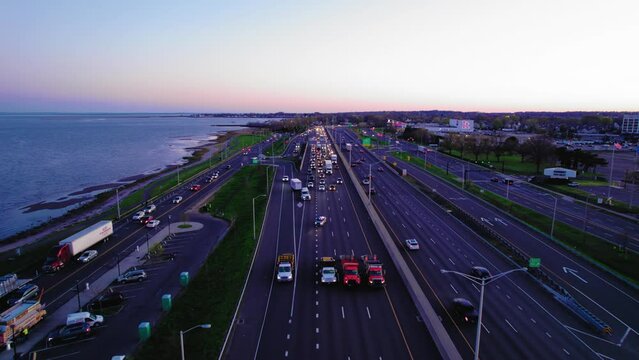 Convoy of Impact attenuator trucks and police car operation on I-95 in New Haven, CT, USA