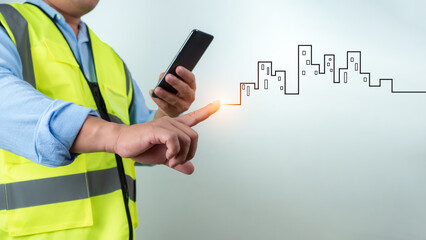 Civil engineer architect Using a smartphone to communicate and give orders to the construction team, Engineer building concept, Background for construction, Technology to construction.