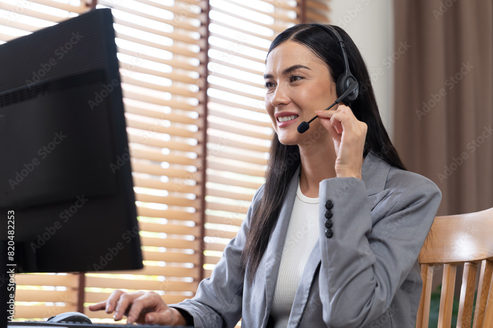Aufkleber female call center operator or customer service helpdesk staff working on workspace while talking on