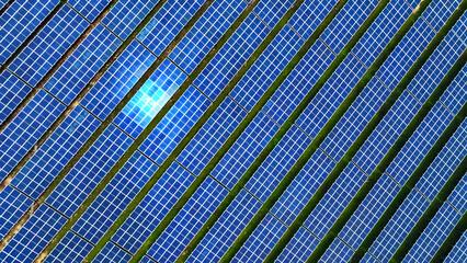 Drone aerial view of a mega solar power plant installed on a mountainside.