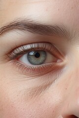 Obraz premium A closeup of a human face with wide eyes and slightly parted lips