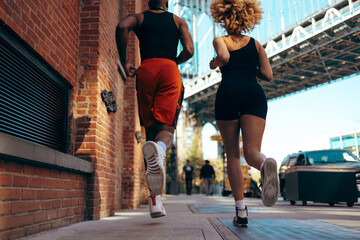 Low angle shot of two African-American joggers from behind