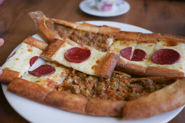 Turkish pide traditional food with beef and vegetables.