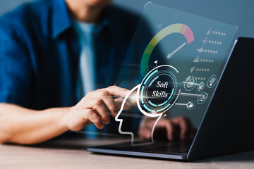 A man is using a laptop with a screen that says 