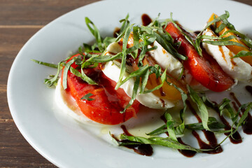 A closeup view of a plate of caprese.