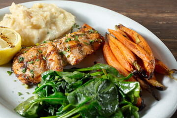 A view of a grilled salmon entree.