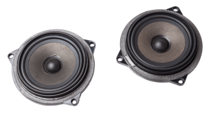 speakers of an acoustic system - an audio for playing music in a car interior on a white isolated background in a photo studio. Spare parts for auto repair in a workshop or for sale for tuning