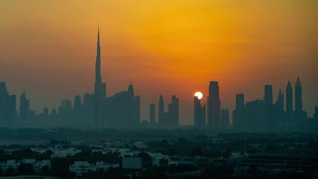 Timelapse, Dubai UAE Downtown Cityscape at Sunset, Silhouette of Towers and Misty Skyline