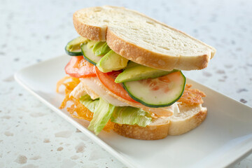 A view of a turkey club sandwich.