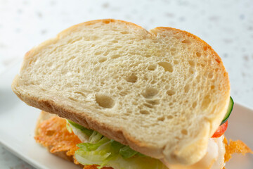 A closeup view of a texture of a sourdough bread slice.