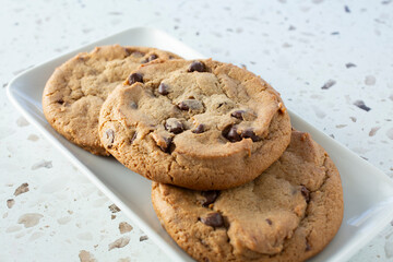 A view of a plate of chocolate chip cookies.