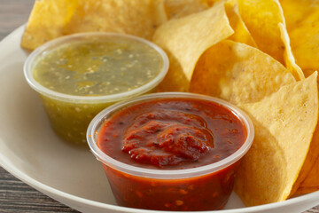 A closeup view of a bowl of chips and salsa.