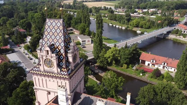 Drone view captures Brand&yacute;s nad Labem castle with town view, road, river, lush.