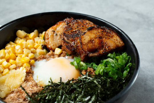 A closeup view of a bowl of pork chasu mazesoba.