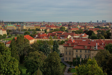 Fototapeta premium Panoramic view of the city of Prague from the observation deck. Streets and architecture of the old city. Romantic panorama of the city. Amazing nature, exquisite architecture and bustling life.