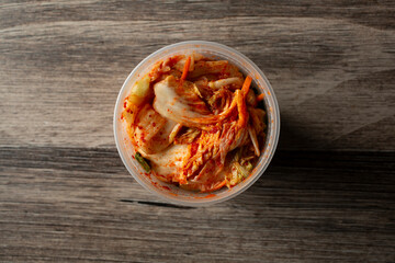 A top down view of a container of kimchi.