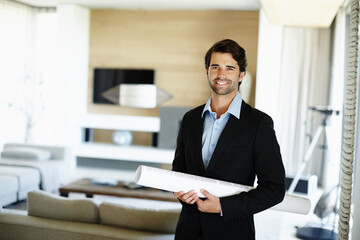 Business man, portrait and confidence with blueprint for planning, building design or floor plan on...