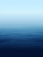 Fototapeta premium A blue ocean with a horizon in the background. The water is calm and the sky is clear