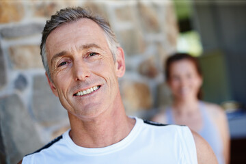 Portrait, smile and training with mature couple outdoor on brick wall for fitness or running...