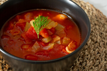 A closeup view of a chicken tomato soup.