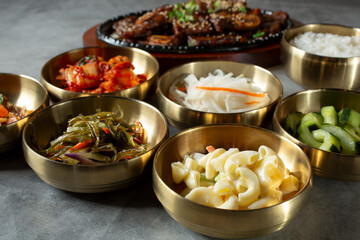 A view of a variety of banchan bowls.