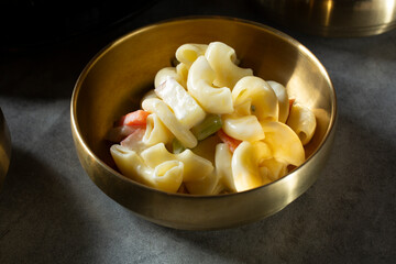 A closeup view of a macaroni salad banchan.